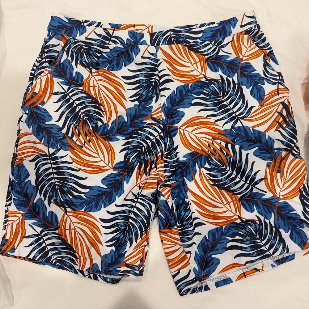 Patpat men's swim trunks size XL. Blue and orange print.